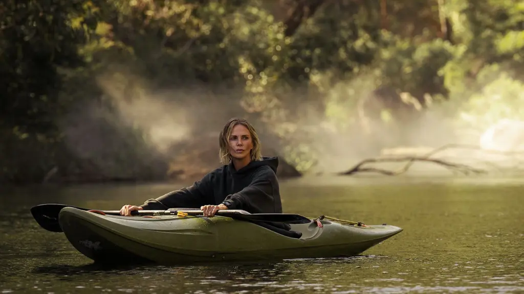 Charlize Theron kayaks a river in Australia